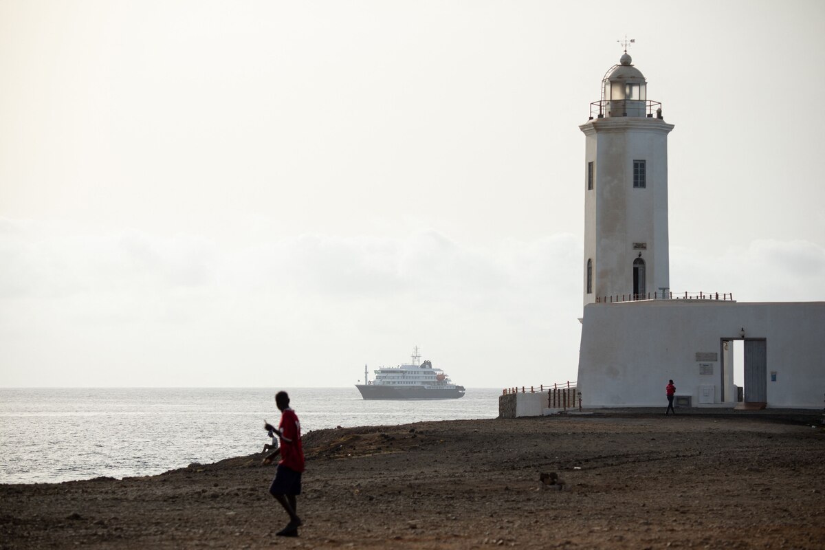 TOPSHOT - A general view of the cruise ship MV Hondius stationary off the port of Praia, the capital of Cape Verde, on May 5, 2026. The WHO said on May 5, 2026 that Spain would "welcome" a cruise ship anchored off Cape Verde with suspected hantavirus cases onboard, enabling a probe and assessment of the risk to the remaining passengers.
WHO epidemic and pandemic preparedness and prevention director Maria Van Kerkhove told reporters the ship would head for the Canary islands. (Photo by AFP)