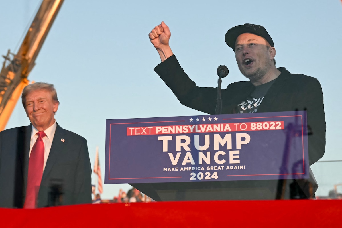 (FILES) Tesla CEO Elon Musk (R) speaks on stage as he joins former US President and Republican presidential candidate Donald Trump during a campaign rally at site of his first assassination attempt in Butler, Pennsylvania on October 5, 2024. Billionaire Elon Musk was expected in court in Philadelphia on October 31, 2024, after a judge ordered him to attend a hearing in a lawsuit seeking to halt his $1 million giveaways to registered US voters in swing states. (Photo by Jim WATSON / AFP)