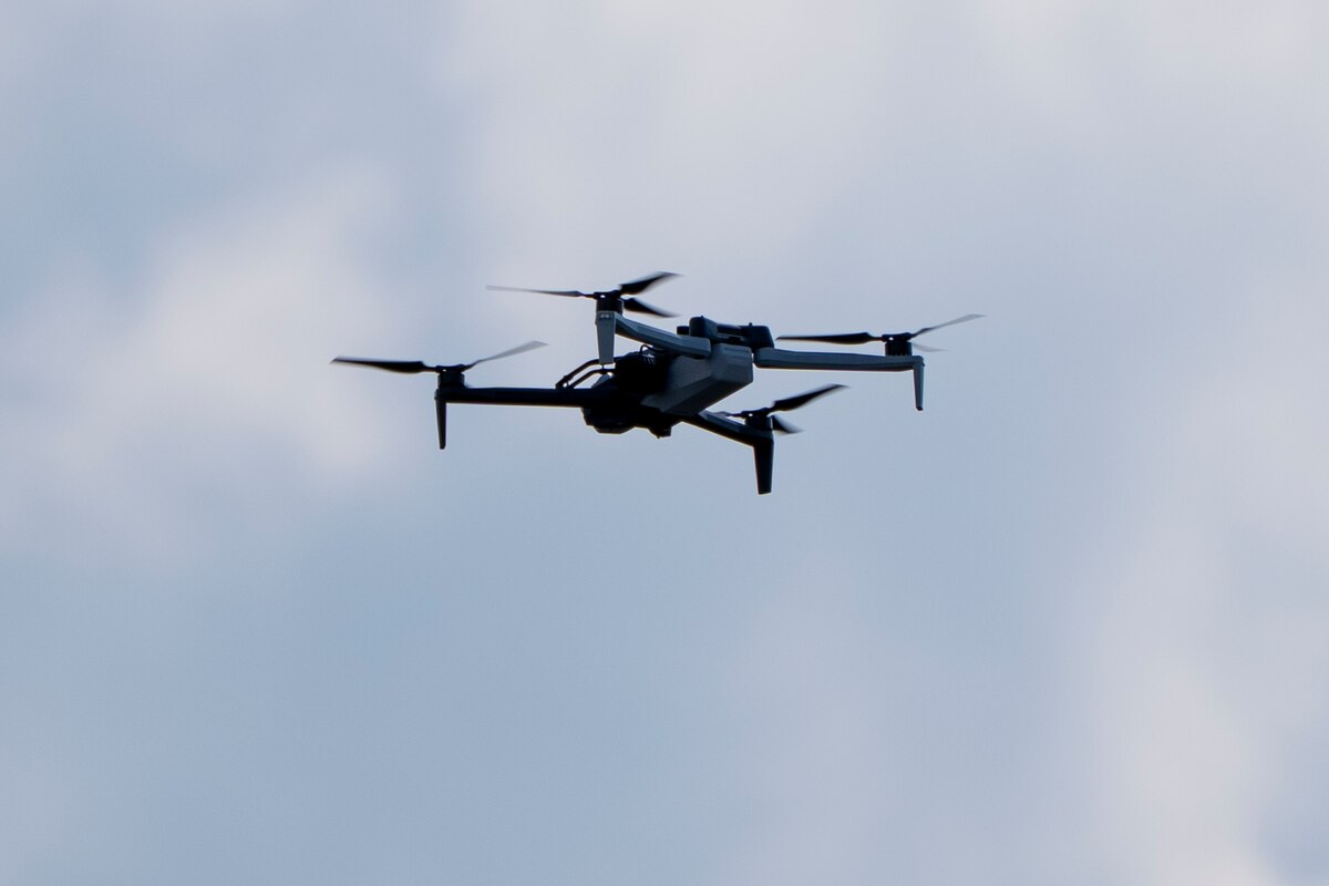 FILE - A law enforcement drone hovers before President Donald Trump departs in his motorcade from the Trump International Golf Club, Saturday, March 1, 2025, in West Palm Beach, Fla. (AP Photo/Alex Brandon, File)