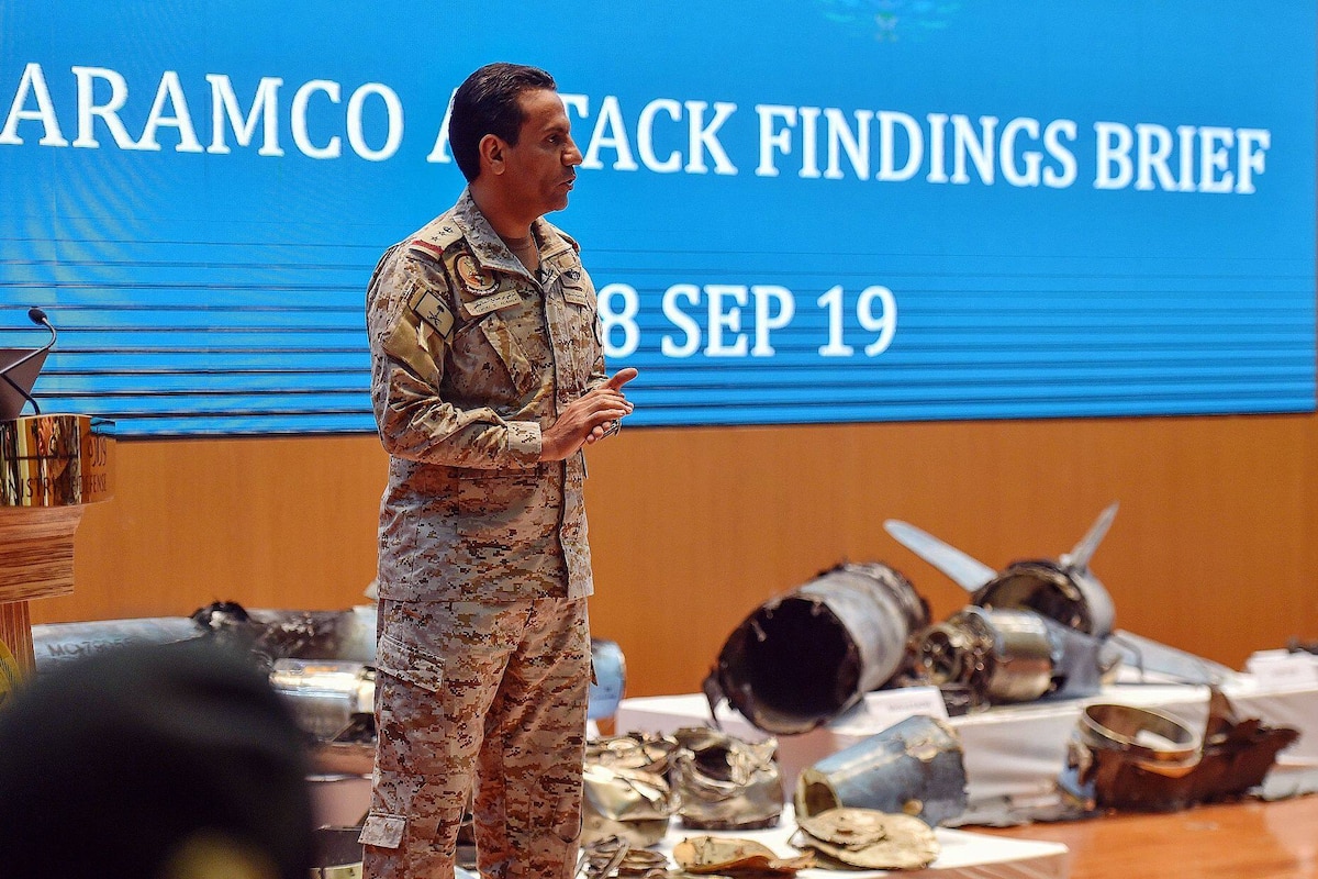 Saudi Colonel Turki bin Saleh al-Malki displays pieces of what he said were Iranian cruise missiles and drones recovered from the attack site that targeted Saudi Aramco's facilities, during a press conference in Riyadh on September 18, 2019. - Saudi Arabia said that strikes on its oil infrastructure came from the "north" and were sponsored by Iran, but that the kingdom was still investigating the exact launch site. (Photo by Fayez Nureldine / AFP)