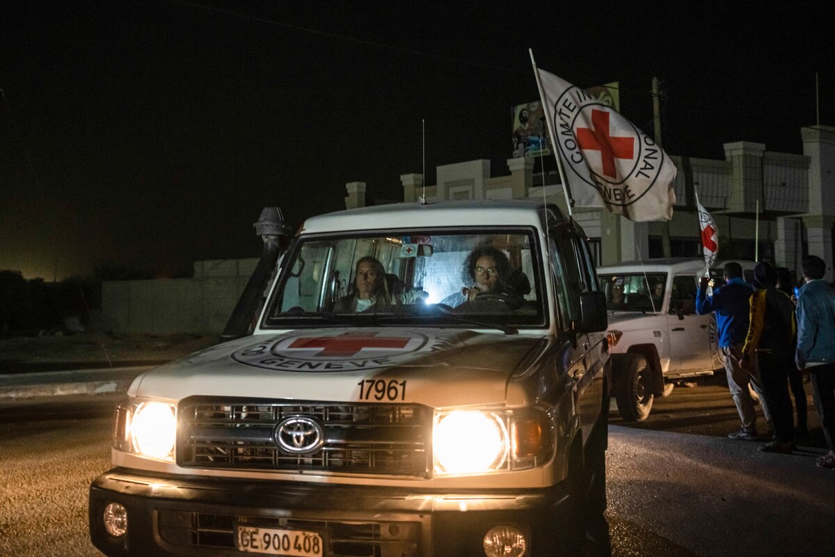 A Red Cross convoy carrying Israeli and foreign hostages heads to Egypt from the Gaza Strip at the Rafah border crossing on Sunday, Nov. 26, 2023. (AP Photo/Fatima Shbair)