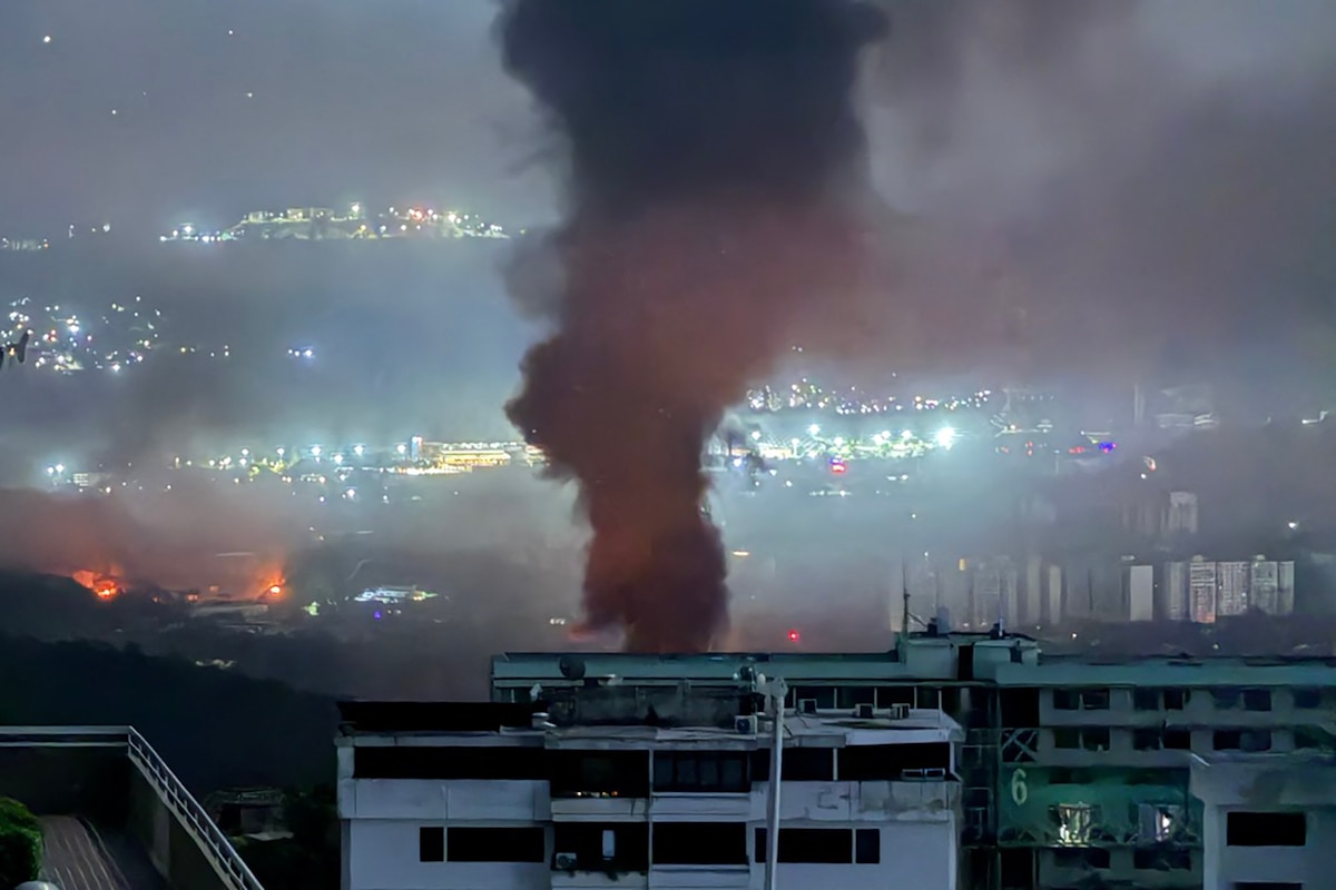 This grab taken on January 3, 2026, from UGC footage released by Jose Abreu in his X account @Jabreu89, shows smoke billowing over Caracas after a series of explosions part of a US military operation that led to the capture of Venezuelan President Nicolas Madruo. The US military operation that led to the capture of Madruo sparked alarm across the international community, with allies and foes of Washington and Caracas expressing disquiet. Charged with "narco-terrorism," the leftist strongman and his wife are being taken to New York to stand trial in federal court, according to US President Donald Trump. No casualty figures are yet available. (Photo by Jose ABREU / @Jabreu89 / X / AFP) / RESTRICTED TO EDITORIAL USE - MANDATORY CREDIT "AFP PHOTO / UGC / JOSE ABREU / @Jabreu89" - NO MARKETING NO ADVERTISING CAMPAIGNS - DISTRIBUTED AS A SERVICE TO CLIENTS