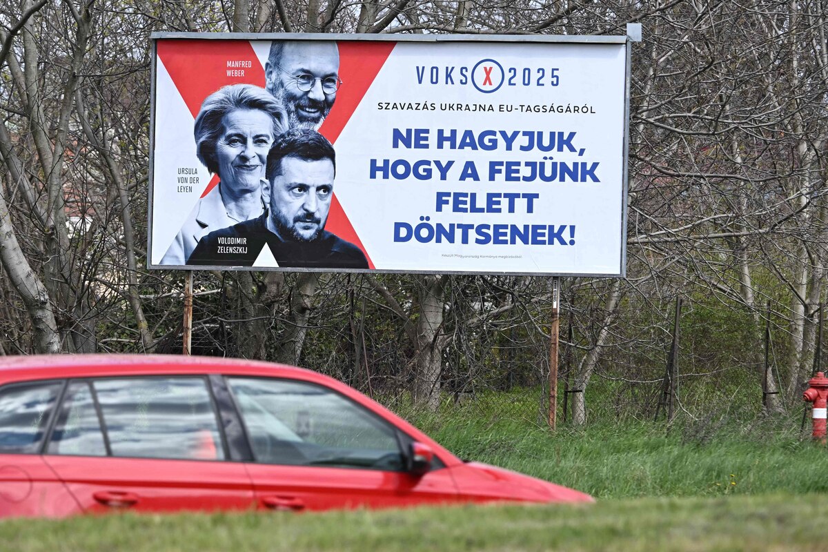 This picture taken on April 07, 2025, in Szekesfehervar, near Budapest, shows a political campaign poster depicting (Back to Front) the President of the European People's Party (EPP) and Leader of the EPP Group in the European Parliament Manfred Weber, President of the European Commission Ursula von der Leyen and Ukrainian President Volodymyr Zelensky and reading 'Voting 2025: about Vote for Ukraine in the EU membership, Don't let them decide for us!' (Photo by Attila KISBENEDEK / AFP)