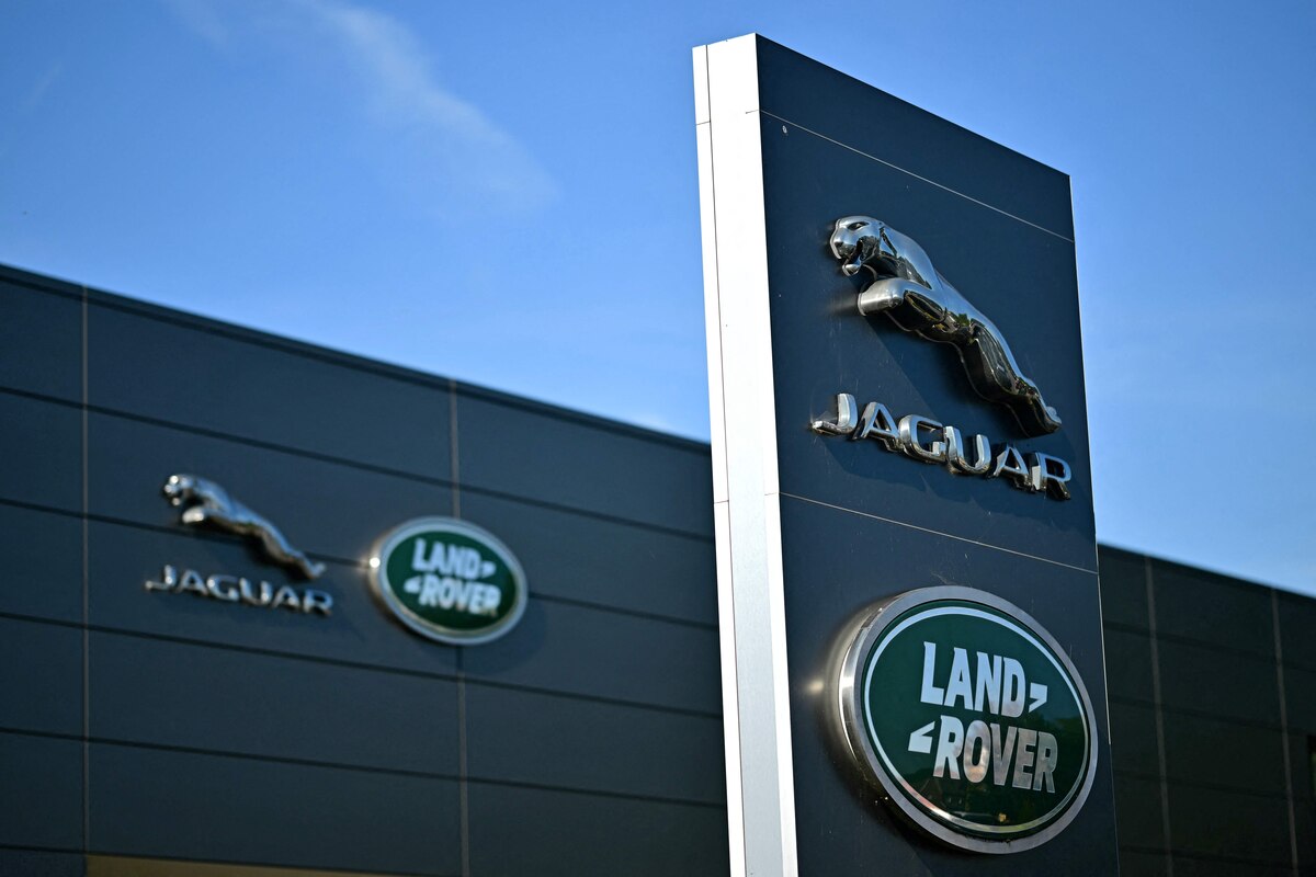 (FILES) Jaguar Land Rover signage is seen on a dealership in Tonbridge, south-east of London on September 29, 2025. British luxury carmaker Jaguar Land Rover announced on September 7, 2026 a voluntary redundancy scheme following months of turmoil caused by a cyberattack and US President Donald Trump's sector-wide tariffs. (Photo by Ben STANSALL / AFP)