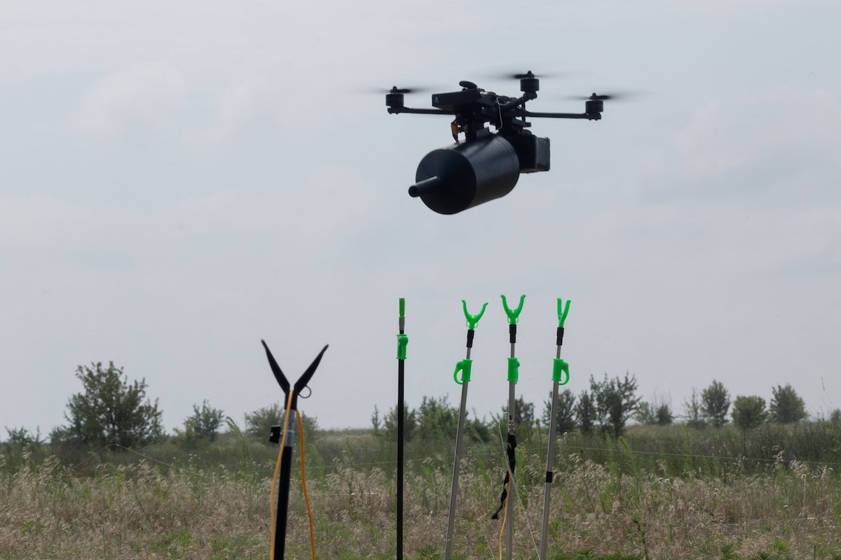 (FILES) An FPV or First-Person View, drone Stalker, using fiber optic, flies during tests at an undisclosed location, on July 10, 2025, amid the Russian invasion of Ukraine. Hundreds of AI-controlled robots operating in unison, talking to each other to autonomously attack targets - a dystopian vision of the future of war that Ukraine's defence industry wants to make a reality. (Photo by Tetiana DZHAFAROVA / AFP)