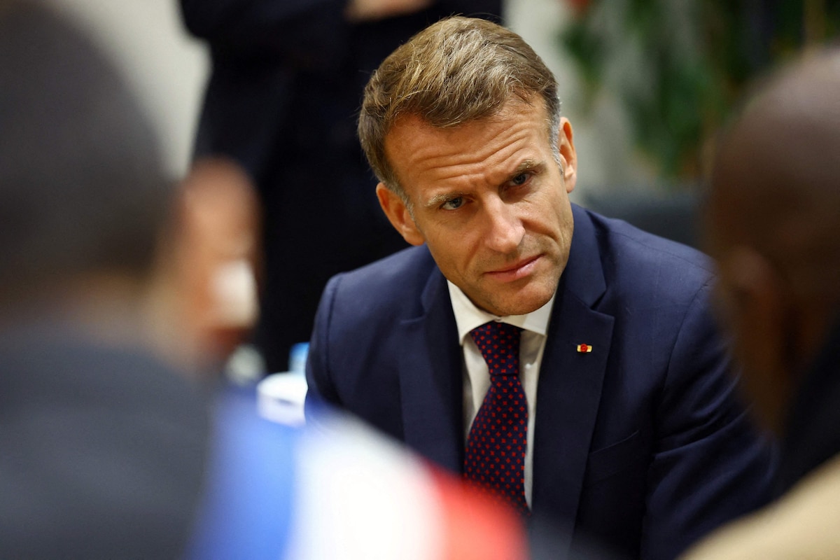 France's President Emmanuel Macron meets with community members at the town hall following a shooting in Trappes, near Paris on October 23, 2026. The National Anti-Terrorism Prosecutor�s Office (Pnat) has announced that it is taking up the case of a man who fired bursts of shots from his car on October 23, morning in the street in Trappes (Yvelines), killing one person and injuring at least four others. (Photo by Hannah McKay / POOL / AFP)