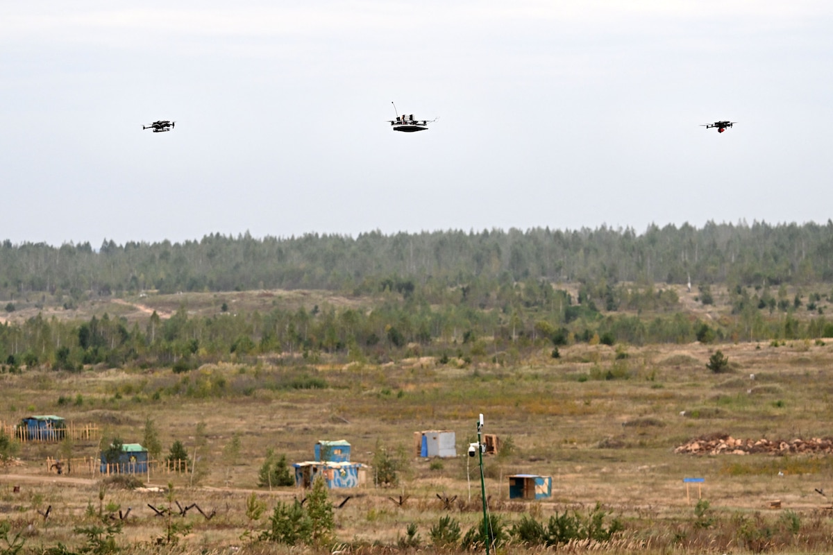 Drones fly during the "Zapad-2025" (West-2025) joint Russian-Belarusian military drills at a training ground near the town of Borisov, east of the capital Minsk, on September 15, 2025. (Photo by Olesya KURPYAYEVA / AFP)