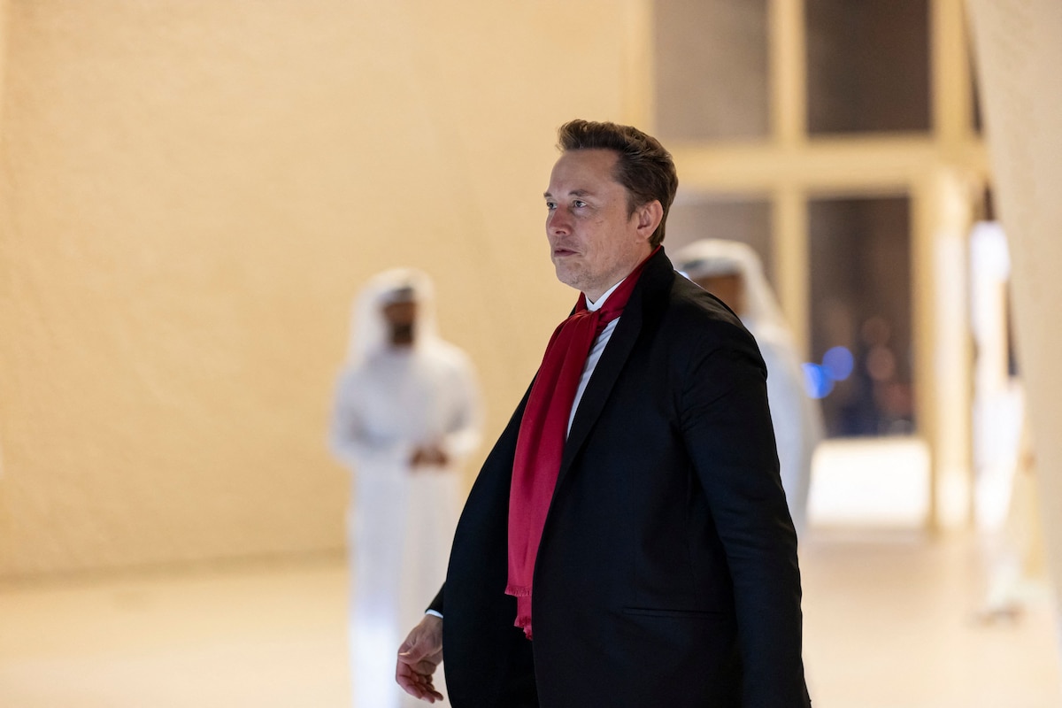 This handout picture provided by the UAE Presidential Court shows CEO of SpaceX and Tesla Elon Musk leaving following a meeting with UAE President Sheikh Mohamed bin Zayed al-Nahyan (unseen) at Zayed National Museum in Abu Dhabi on December 20, 2025. (Photo by Ryan CARTER / UAE PRESIDENTIAL COURT / AFP) / RESTRICTED TO EDITORIAL USE - MANDATORY CREDIT "AFP PHOTO / UAE PRESIDENTIAL COURT / RYAN CARTER - NO MARKETING NO ADVERTISING CAMPAIGNS - DISTRIBUTED AS A SERVICE TO CLIENTS