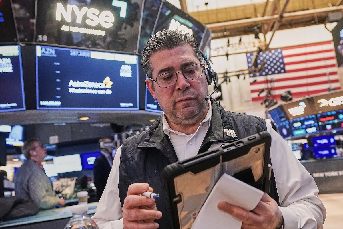 FILE - Trader Michael Capolino works on the floor of the New York Stock Exchange, Monday, Feb. 2, 2026. (AP Photo/Richard Drew, File)
