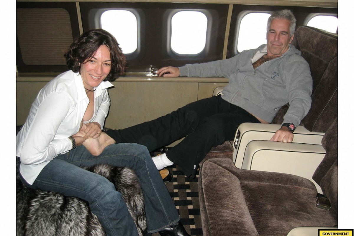 (FILES) This undated trial evidence image obtained December 8, 2021, from the US District Court for the Southern District of New York shows British socialite Ghislaine Maxwell and US financier Jeffrey Epstein. Jeffrey Epstein was not murdered, did not blackmail prominent figures and did not keep a "client list," the FBI and Justice Department said Monday, debunking notable conspiracy theories about the disgraced US financier. The conclusions came after an "exhaustive review" of the evidence amassed against Epstein, who died by suicide in a New York prison in 2019 after being charged with sex trafficking, the agencies said in a joint memorandum. (Photo by Handout / US District Court for the Southern District of New York / AFP) / RESTRICTED TO EDITORIAL USE - MANDATORY CREDIT "AFP PHOTO / US District Court for the Southern District of New York" - NO MARKETING - NO ADVERTISING CAMPAIGNS - DISTRIBUTED AS A SERVICE TO CLIENTS