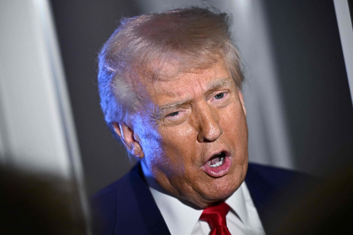 US President Donald Trump speaks to reporters while in flight on board Air Force One, en route to Miami, Florida on April 3, 2025. Trump is travelling to the Trump National Doral Golf Club before going to his Mar-a-Lago Resort. (Photo by MANDEL NGAN / AFP)
