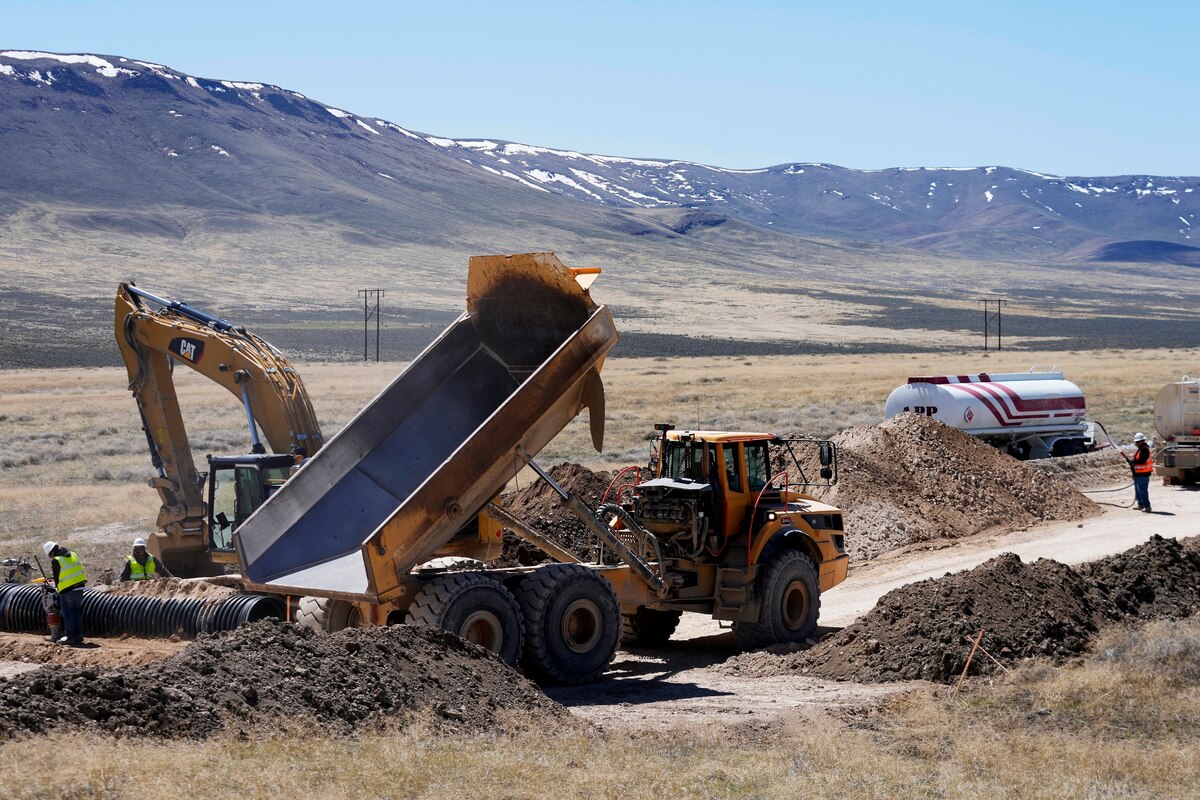FILE - Construction continues at the Lithium Nevada Corp. mine site Thacker Pass project on April 24, 2023, near Orovada, Nev. The Reno-Sparks Indian Colony is abandoning its 3-year lawsuit aimed at blocking a lithium mine currently under construction at Thacker Pass in northwest Nevada. Tribal leaders say the U.S. Interior Department refuses to accept their arguments that the mine's on a sacred site where more than two dozen Paiute and Shoshone ancestors were massacred in 1865. (AP Photo/Rick Bowmer, File)