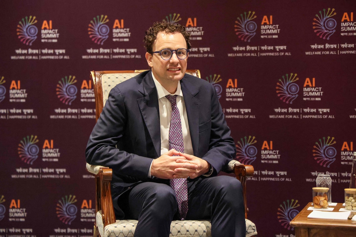 Anthropic CEO Dario Amodei looks on during a meeting with France's President Emmanuel Macron on the sidelines of the AI Impact Summit in New Delhi on February 19, 2026. (Photo by Ludovic MARIN / AFP)