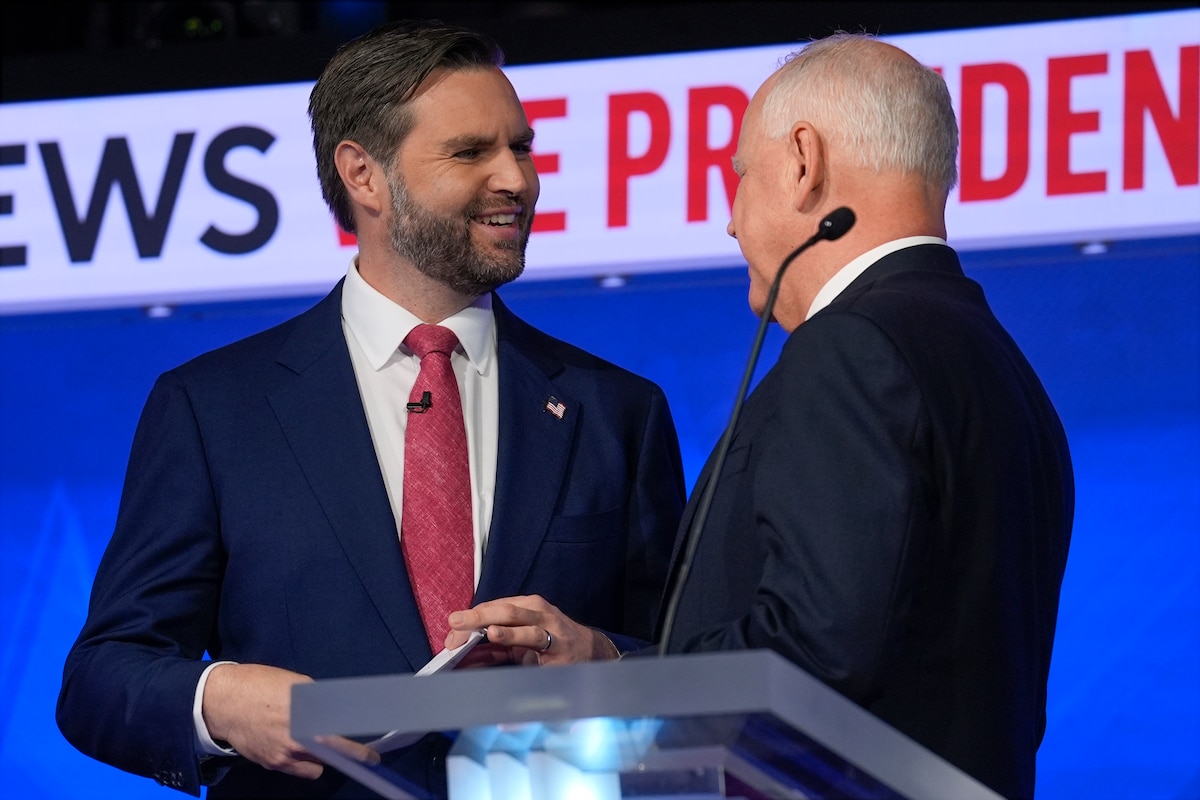 Republican vice presidential nominee Sen. JD Vance, R-Ohio, talks with Democratic vice presidential candidate Minnesota Gov. Tim Walz after the vice presidential debate hosted by CBS News Tuesday, Oct. 1, 2024, in New York. (AP Photo/Matt Rourke)
