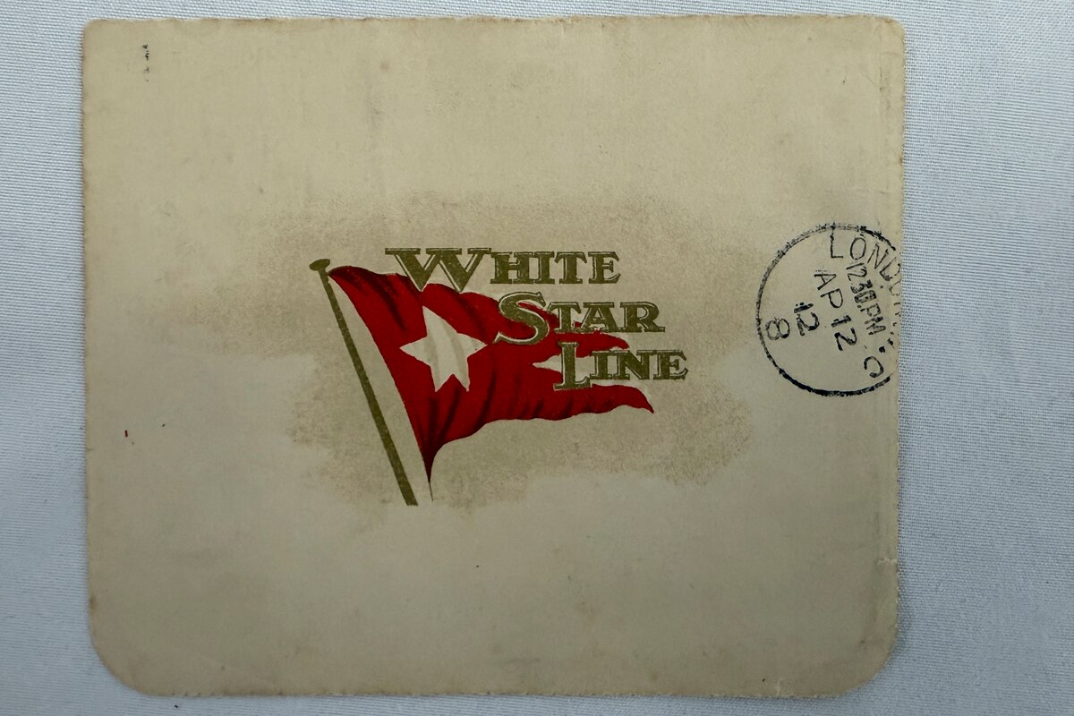 This undated handout picture provided by the auctioneers Henry Aldridge & Son, England, shows a lettercard, penned by one of the Titanic's most well-known survivors from onboard the ship days before it sank, which has sold for 300,000 pounds ($399,000) at auction. (Henry Aldridge & Son via AP)