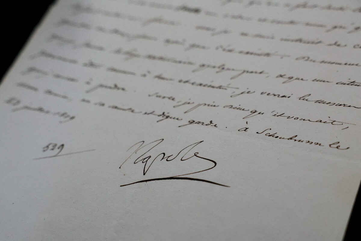 (FILES) This photograph taken on April 23, 2025, shows a letter dated July 23, 1809, concerning the arrest of Pope Pius VII, written by Napoleon I and signed "Napole", displayed at the Osenat auction house offices in Paris. A letter from Napoleon pretending to disapprove of the arrest of Pope Pius VII, even though he had ordered it, sold for 26,360 euros at auction in Fontainebleau on April 27, 2025, announced the auction house Osenat, which organised the auction. (Photo by Thomas SAMSON / AFP)