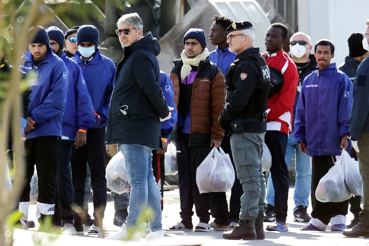 FILE - Migrants follow the authorities after their arrival in the port of Shengjin, northwestern Albania, Tuesday, Jan. 28, 2025. (AP Photo/Vlasov Sulaj, File)