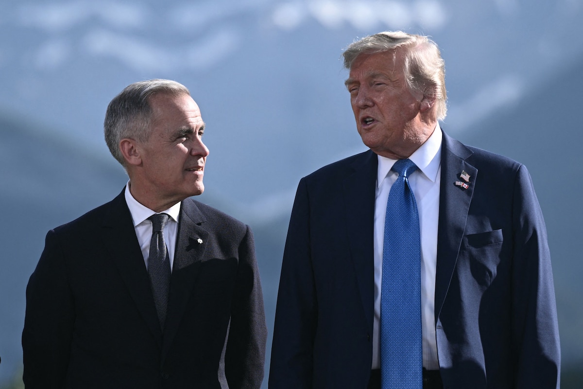 (FILES) Canadian Prime Minister Mark Carney (L) and US President Donald Trump pose for a family photo during the Group of Seven (G7) Summit at the Kananaskis Country Golf Course in Kananaskis, Alberta, Canada on June 16, 2025. US President Donald Trump said October 23, 2025 that he was immediately ending all trade talks with Canada, accusing it of misquoting former president Ronald Reagan in an advertising campaign against tariffs. �Based on their egregious behavior, ALL TRADE NEGOTIATIONS WITH CANADA ARE HEREBY TERMINATED,� Trump said on his Truth Social network. (Photo by Brendan SMIALOWSKI / AFP)