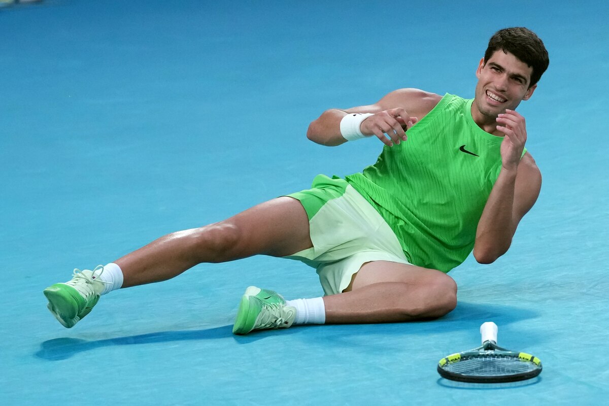 Carlos Alcaraz of Spain celebrates after defeating Alexander Zverev of Germany in their semifinal match at the Australian Open tennis championship in Melbourne, Australia, Friday, Jan. 30, 2026. (AP Photo/Aaron Favila)