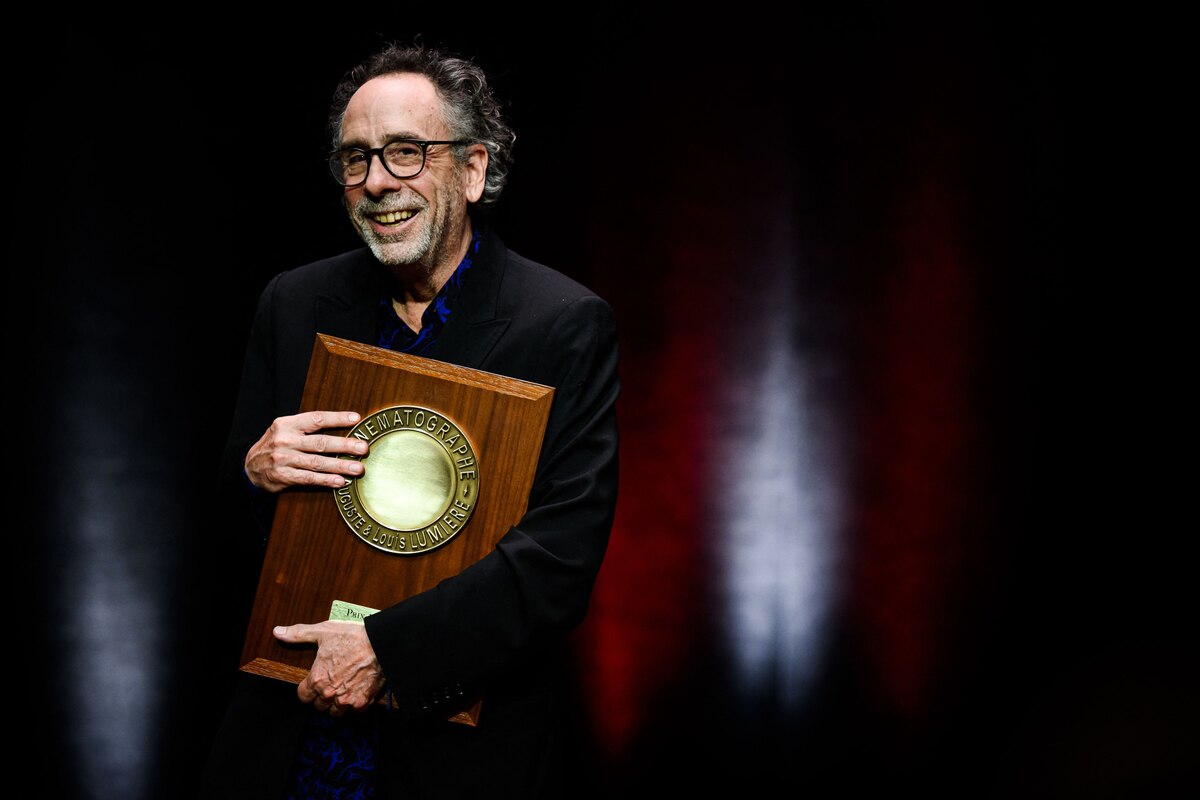US director Tim Burton reacts as he receives the Lumiere Award during the award ceremony of the 14th edition of the Lumiere Film Festival in Lyon, central-eastern France, on October 21, 2022. (Photo by JEFF PACHOUD / AFP)